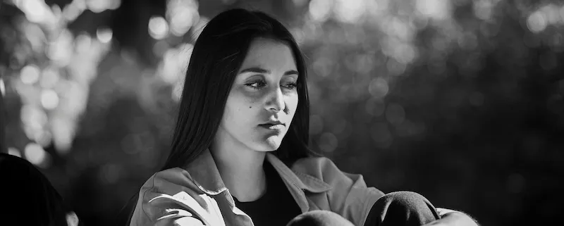 a girl sitting and thinking